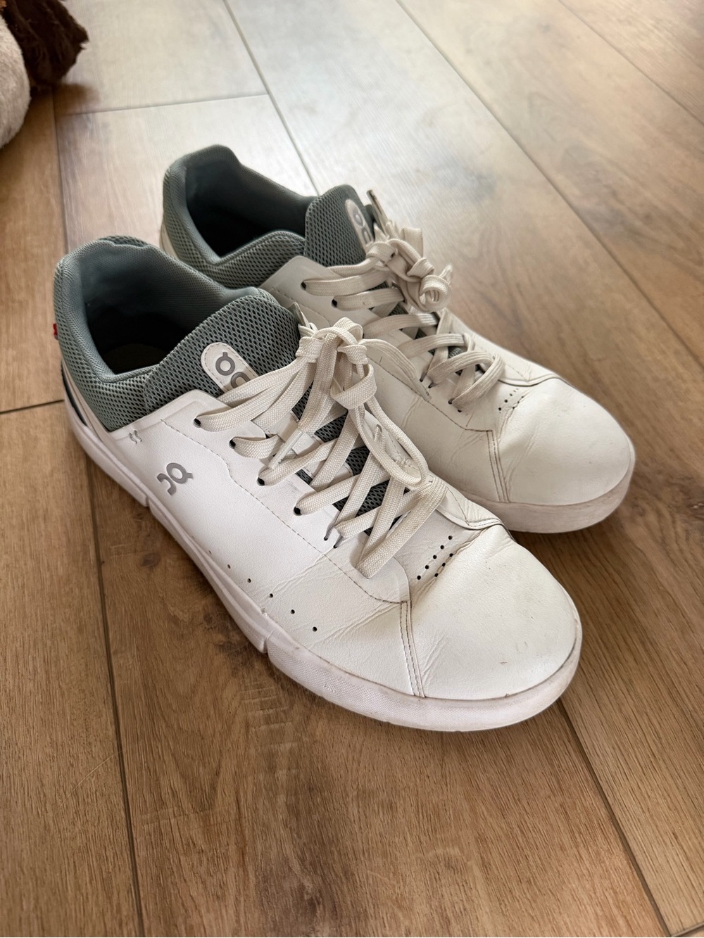 On Running White and gray Roger’s. Good condition